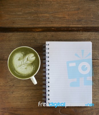 Green Tea Later With Blank Note Book Stock Photo