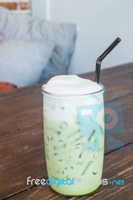 Green Tea Latte Into A Cold Glass Stock Photo