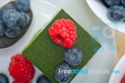 Green Tea Matcha Mousse Cake With Berries Stock Photo