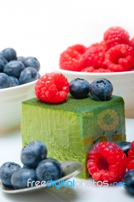 Green Tea Matcha Mousse Cake With Berries Stock Photo