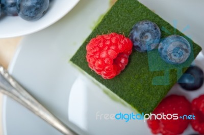 Green Tea Matcha Mousse Cake With Berries Stock Photo
