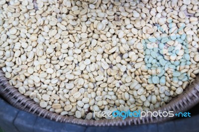 Green Unroasted Coffee Beans In The Basket Stock Photo
