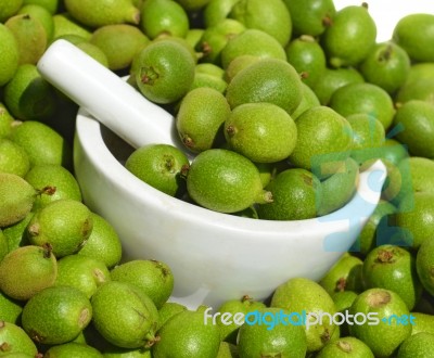 Green Young Walnuts In Husks Stock Photo