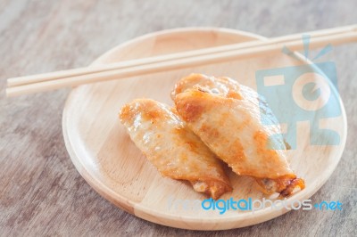 Grilled Chicken Wings On Wooden Plate Stock Photo