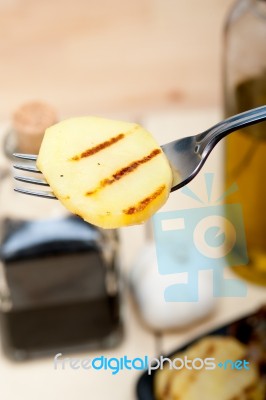 Grilled Potato On A Fork Stock Photo