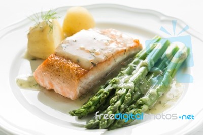 Grilled Salmon With Boiled Potatoes And Asparagus On White Plate… Stock Photo