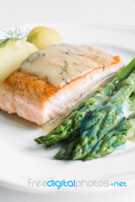 Grilled Salmon With Boiled Potatoes And Asparagus On White Plate… Stock Photo