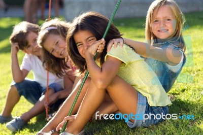 Group Of Childrens Having Fun In The Park Stock Photo