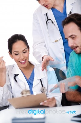 Group Of Doctors Working Together Stock Photo