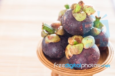 Group Of Mangoesteen On Wooden Tray Stock Photo