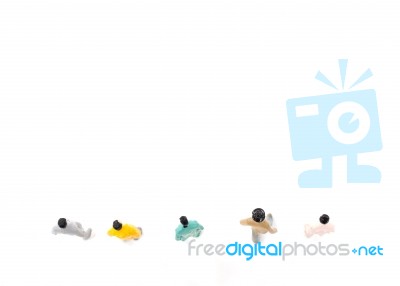 Group Of Miniature People Standing On White Background Stock Photo