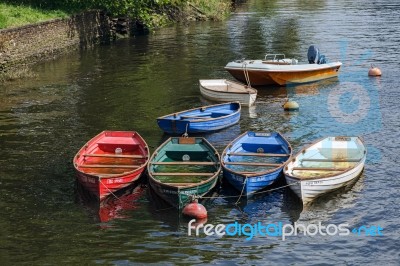 Group Of Rowing Boats Full With Rainwater Stock Photo