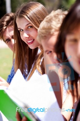 Group Of Students Reading Books Stock Photo