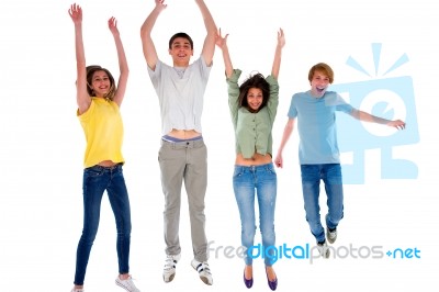 Group Of Teenagers Jumping Stock Photo