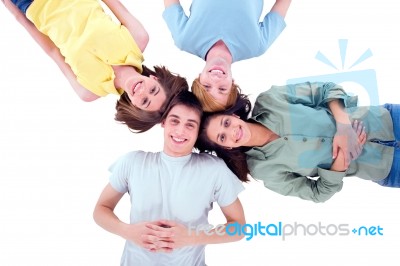 Group Of Teenagers Lying Down Stock Photo
