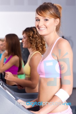 Group Of Women Running On Treadmill Stock Photo