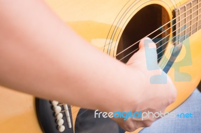 Guitarist Hand Playing Acoustic Guitar Stock Photo