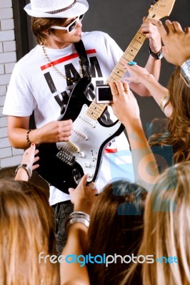 Guitarist Infront Of Fans Stock Photo