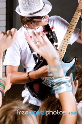 Guitarist Performing For Fans Stock Photo