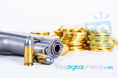 Gun Bullets And Money Showing A Dangerous Side To Life Stock Photo