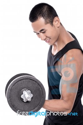 Guy Doing Exercises With Dumbbell Stock Photo
