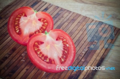 Half Cut Of Red Tomato In Heart Shape Stock Photo
