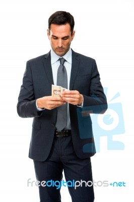 Half Length Portrait Of A Businessman Counting Money Stock Photo