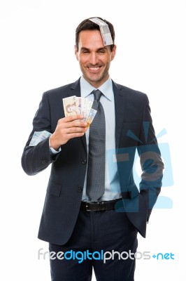 Half Lenth Portrait Of A Businessman Smiling In Falling Money Stock Photo