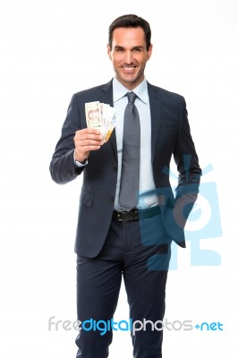 Half Lenth Portrait Of A Businessman Smiling In Falling Money Stock Photo