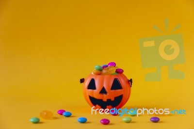 Halloween Jack O Lantern Bucket Filled With Candies Stock Photo