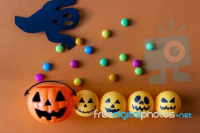 Halloween Jack O Lantern Bucket With Candies On Orange Backgroun… Stock Photo