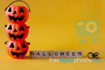 Halloween Jack O Lantern Bucket With Halloween Word On Yellow Ba… Stock Photo