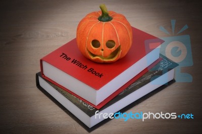 Halloween Pumpkin And Witch Book Stock Photo