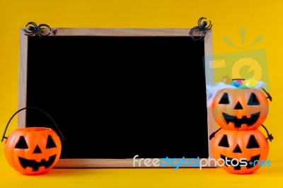 Halloween Pumpkins Bucket With Chalkboard On Yellow Background ,… Stock Photo