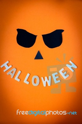 Halloween Word Wooden With Black Eyes On Orange Background Stock Photo