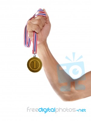 Hand And Gold Medal Isolated On White Stock Photo