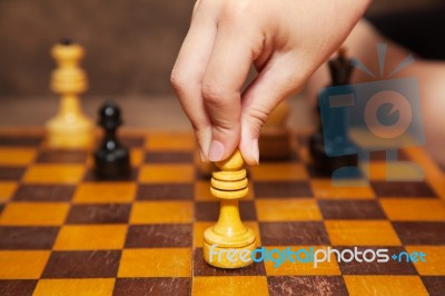 Hand Holding A Chess Piece Stock Photo