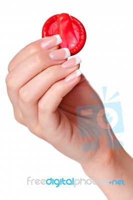 Hand Holding A Condom Stock Photo