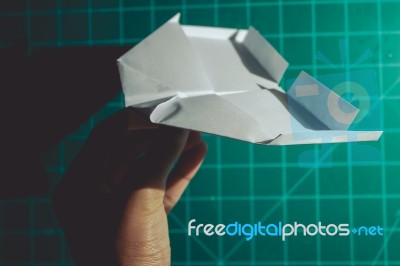 Hand Holding A Paper Airplane Engineering Background Stock Photo
