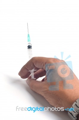 Hand Holding A Syringe Filled With Liquid Medicine Stock Photo