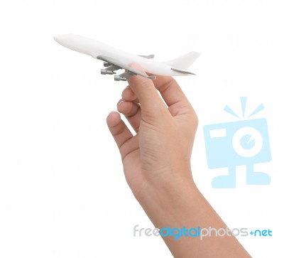 Hand Holding Airplane Toy Model Isolated On White Background Stock Photo