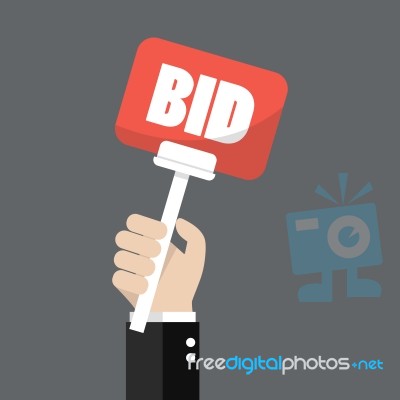 Hand Holding Auction Paddle Stock Image