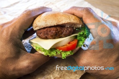 Hand Holding Ham Burger Ready To Eating Stock Photo