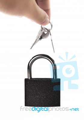 Hand Holding Keys And Lock Stock Photo
