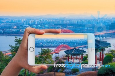 Hand Holding Smart Phone Take A Photo At Banghwa Bridge In Seoul,korea Stock Photo Hand Holding Smart Phone Take A Photo At Banghwa Bridge In Seoul,korea Stock Photo