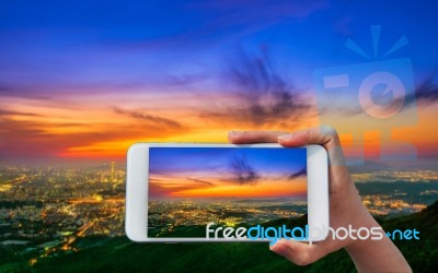 Hand Holding Smart Phone Take A Photo At South Korea Skyline Of Seoul, The Best View Of South Korea Stock Photo