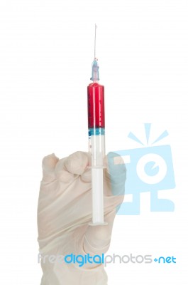 Hand Holding Syringe Stock Photo