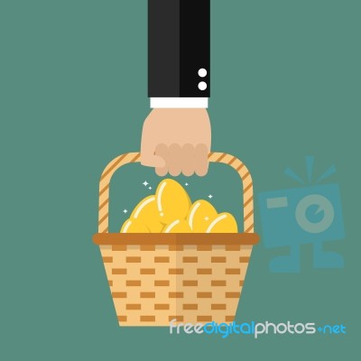 Hand Holding Wicker Basket With Golden Eggs Stock Image