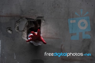 Hand Of Ghost Woman Or Zombie Penetrate Wall Stock Photo