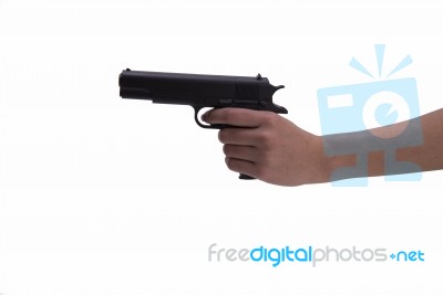 Hand Of Woman With Gun On White Background Stock Photo